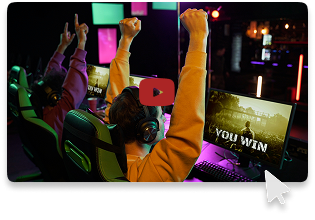 Two gamers celebrate a win in a neon-lit esports gaming lounge, with a 'YOU WIN' screen displayed, reflecting the excitement and user satisfaction supported by KuyaPlay customer service.