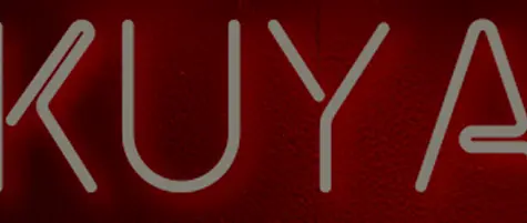 A stylized neon sign spelling 'KUYAPLAY' in modern lettering against a deep red background, symbolizing the brand's presence and commitment to KuyaPlay customer service.